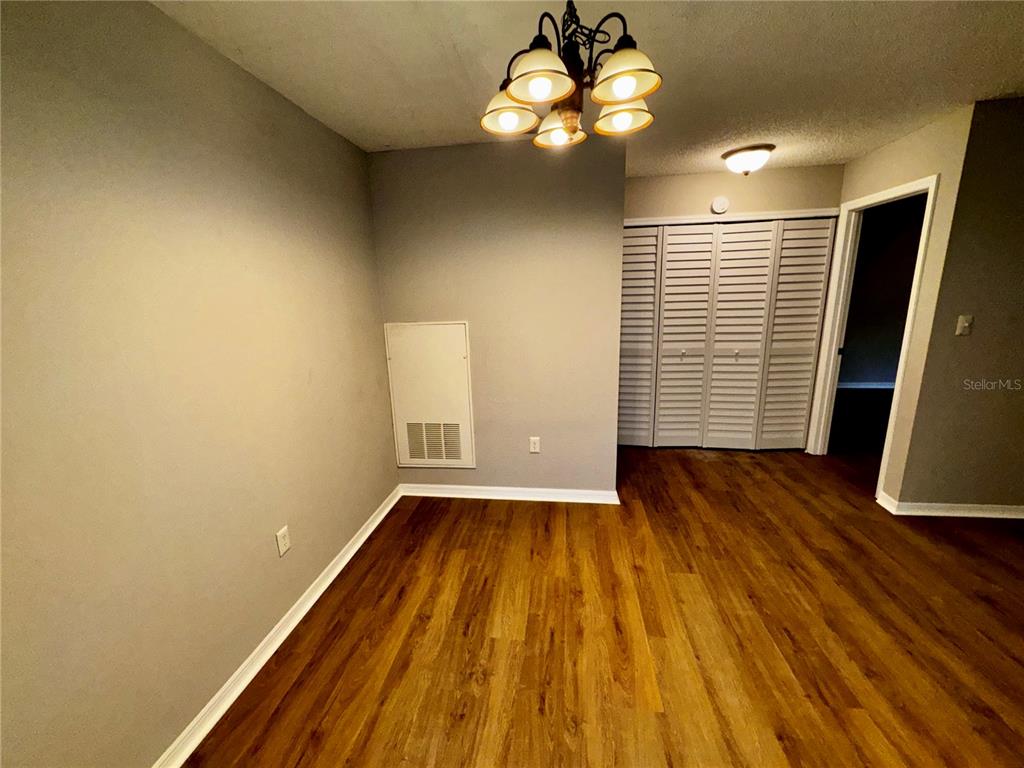 180 Waterfall Way, Unit 203 Altamonte Springs, FL 32714 - Photo 12 of 26 wooden floor in an empty room with a window