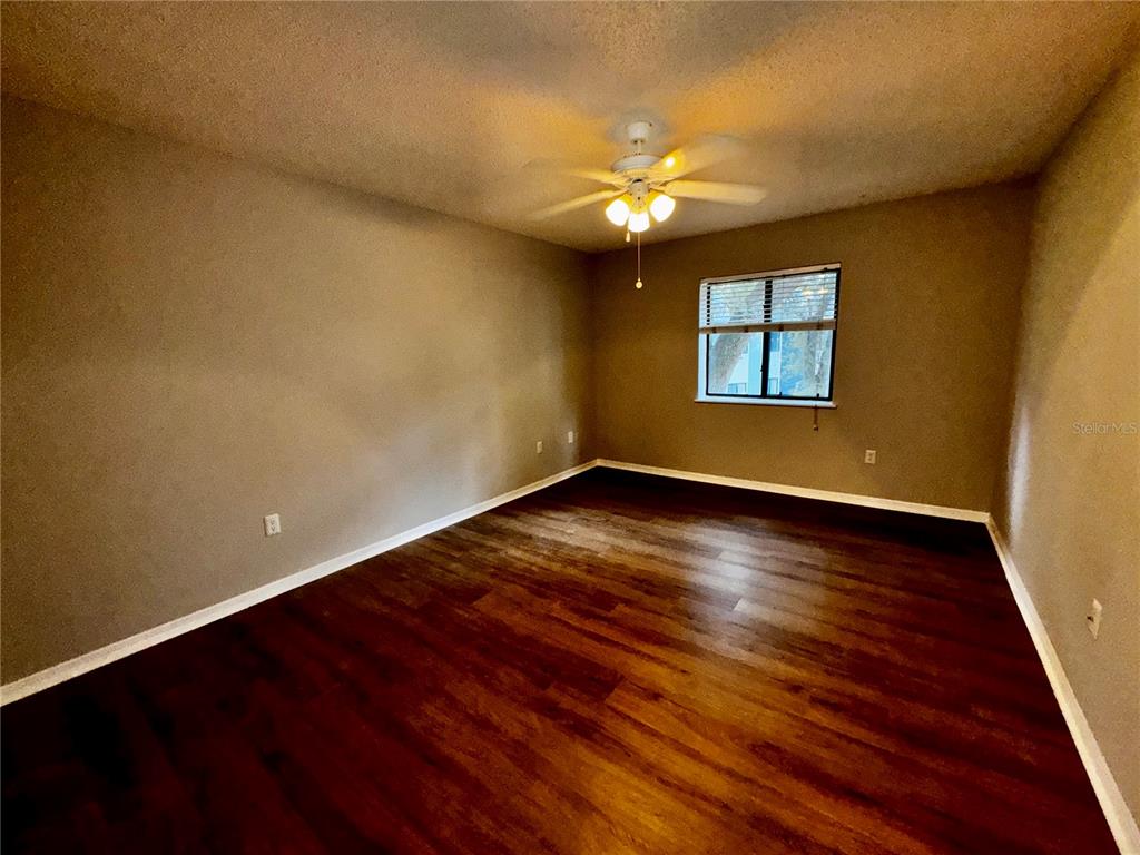 180 Waterfall Way, Unit 203 Altamonte Springs, FL 32714 - Photo 18 of 26 a view of room with window and wooden floor
