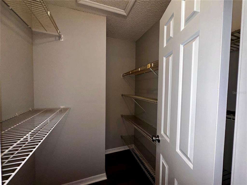 180 Waterfall Way, Unit 203 Altamonte Springs, FL 32714 - Photo 23 of 26 a view of storage and utility room with racks on the wall