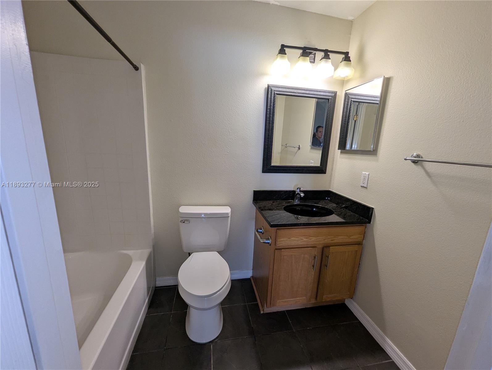 78 Pine Grove Drive Palm Coast, FL 32164 - Photo 41 of 49 a bathroom with a toilet a sink and bathtub