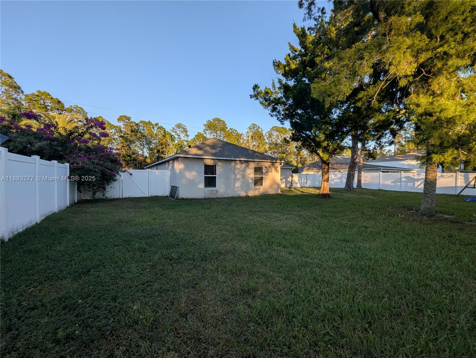 78 Pine Grove Drive Palm Coast, FL 32164 - Photo 9 of 49 a backyard of a house with lots of green space