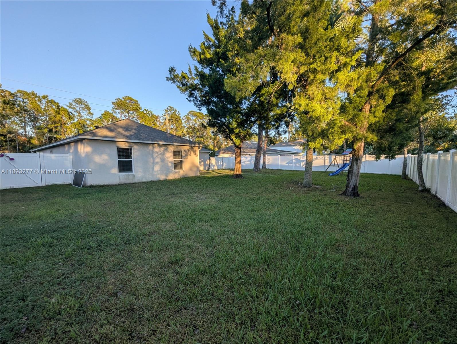 78 Pine Grove Drive Palm Coast, FL 32164 - Photo 10 of 49 a front view of a house with a garden
