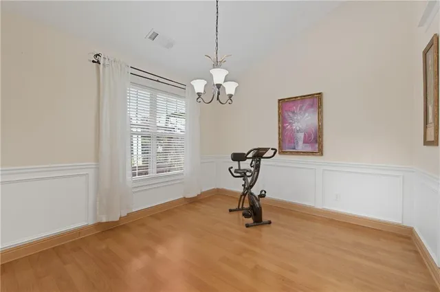 a view of a livingroom with a window and a chandelier