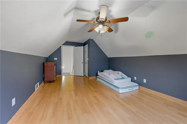 a bedroom with a bed and cabinets