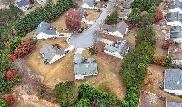 an aerial view of a house with outdoor space