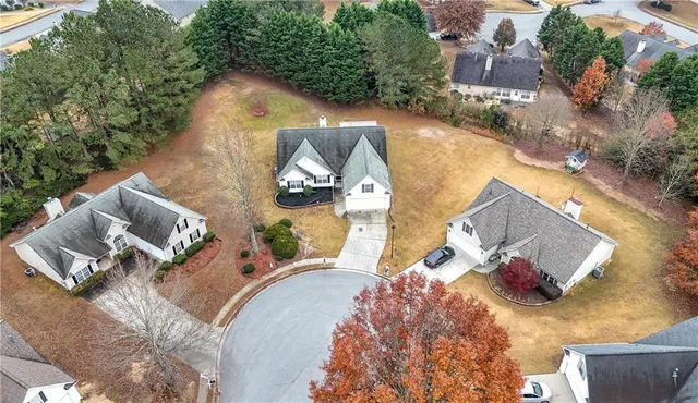 an aerial view of a house with outdoor space