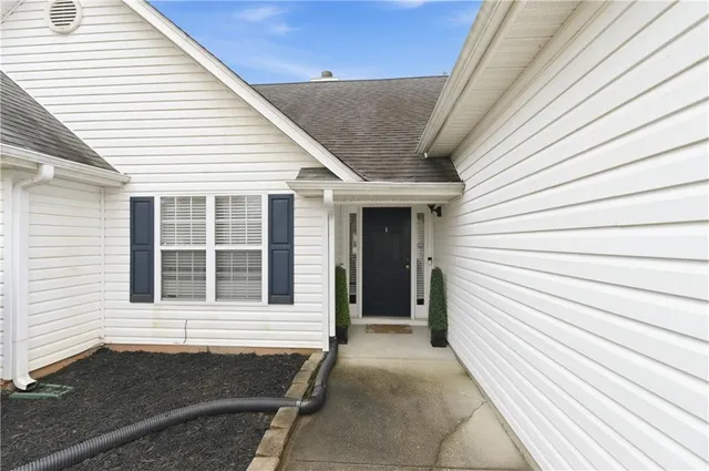 a view of a house with a barbeque