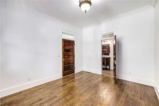a dining room with furniture a chandelier and window