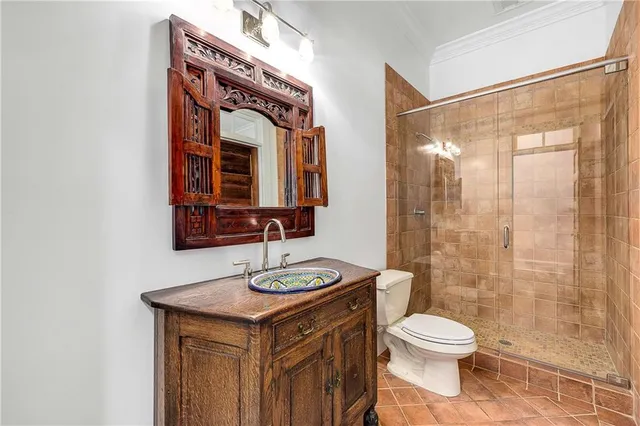 a living room with furniture kitchen view and a large window