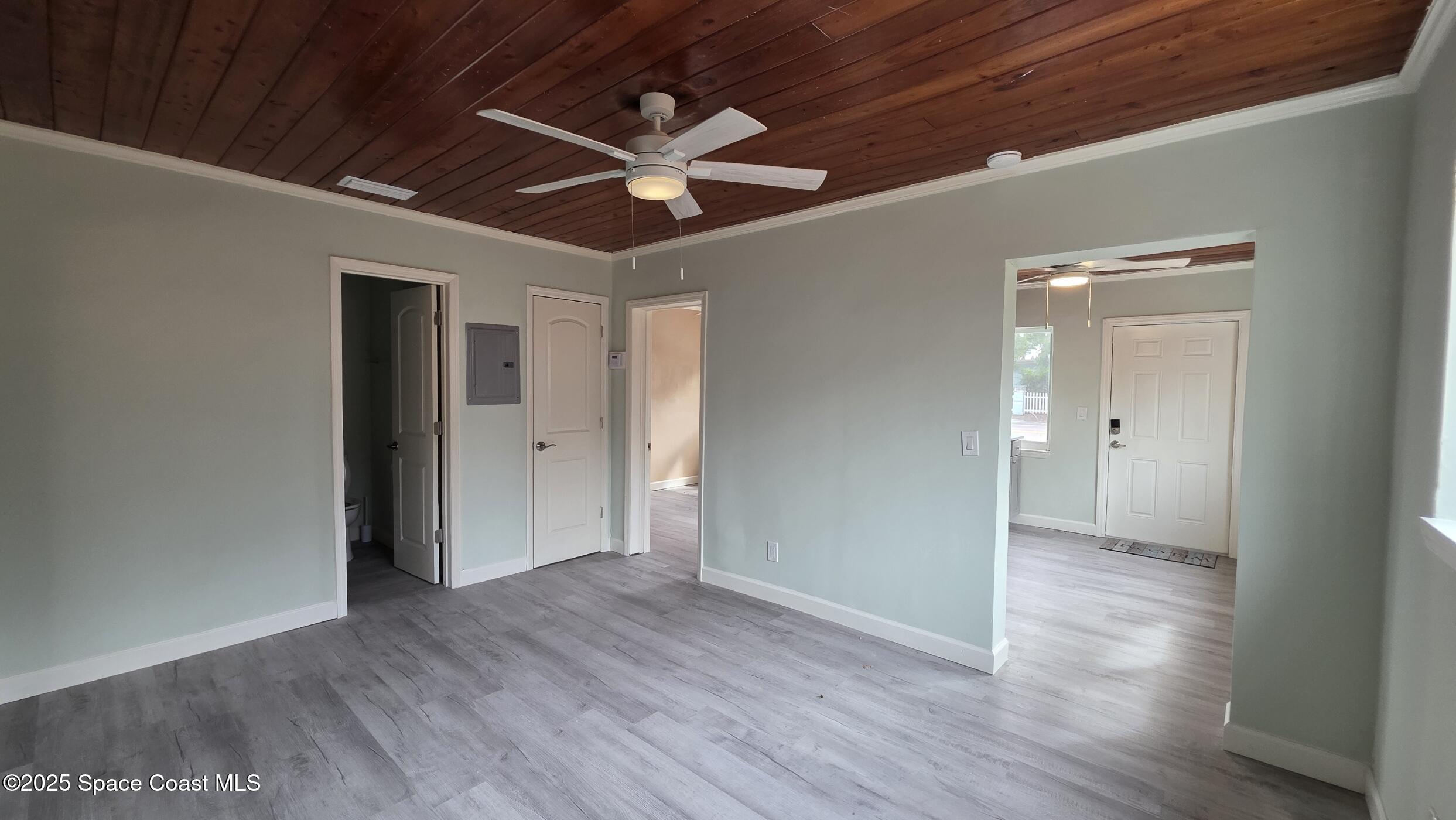6409 Ridgewood Avenue Cocoa Beach, FL 32931 - Photo 5 of 17 wooden floor in an empty room