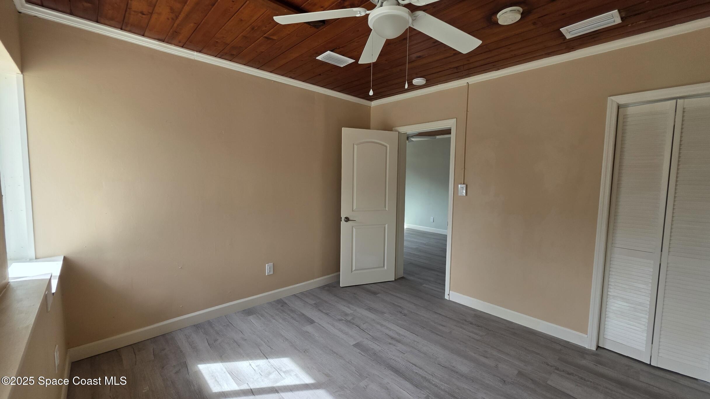 6409 Ridgewood Avenue Cocoa Beach, FL 32931 - Photo 6 of 17 a view of hallway with wooden floor