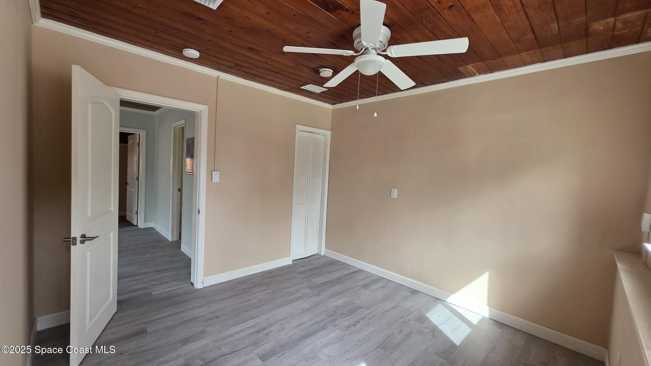 6409 Ridgewood Avenue Cocoa Beach, FL 32931 - Photo 7 of 17 wooden floor in an empty room