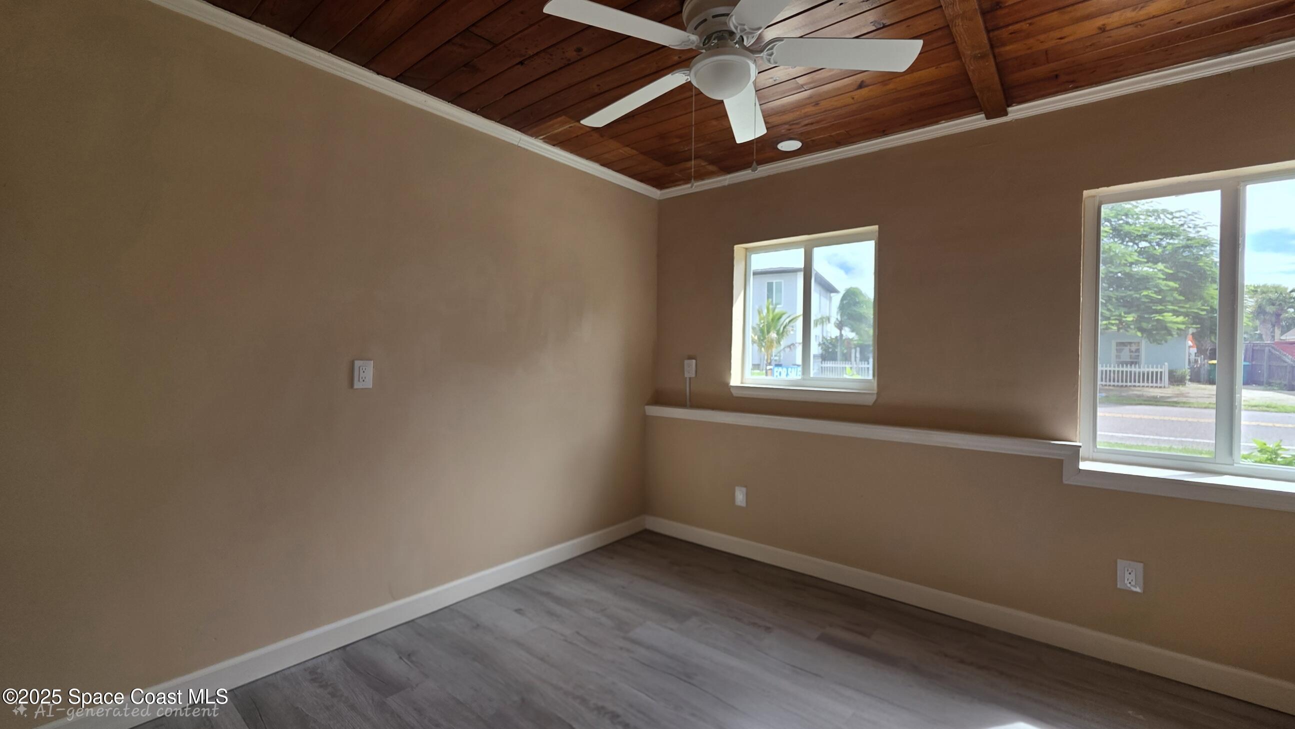 6409 Ridgewood Avenue Cocoa Beach, FL 32931 - Photo 8 of 17 a view of an empty room with a window
