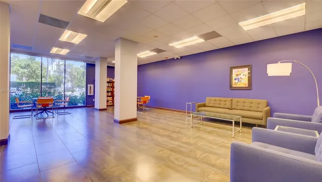 a outdoor space with lots of chairs and a couch