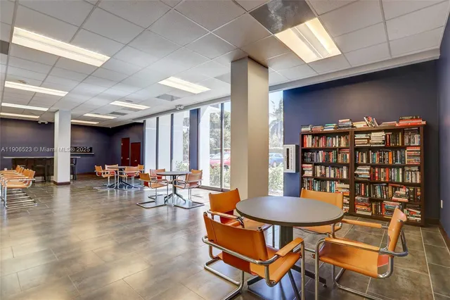 a view of a dining area with furniture and wooden floor