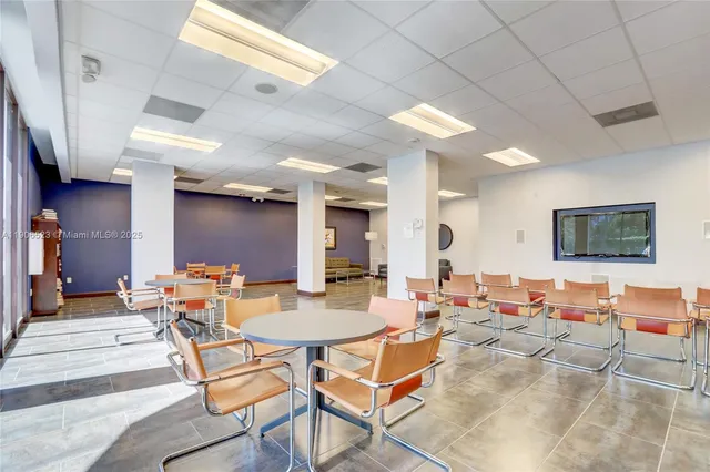 a lobby with furniture and window