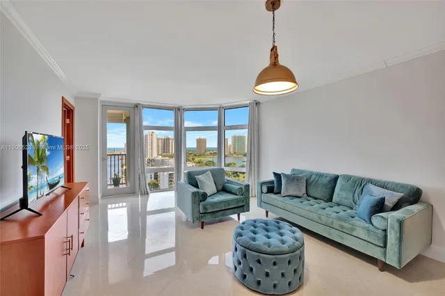 a living room with furniture a flat screen tv and a large window