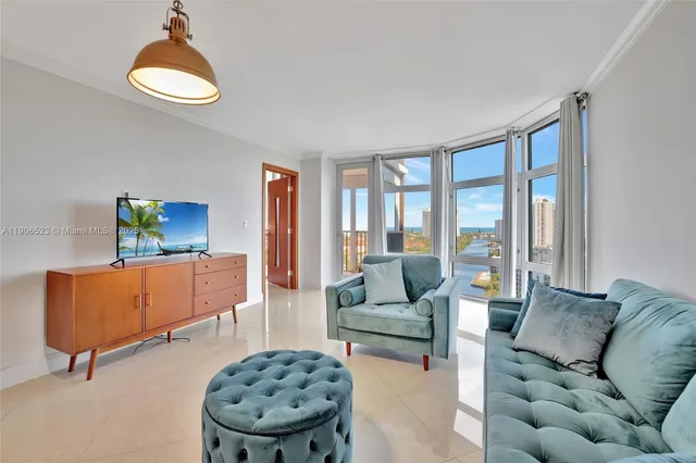 a living room with furniture and a large window
