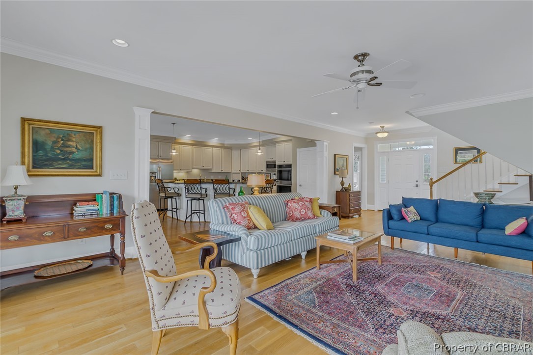 507 Sunnybank Road Reedville, VA 22539 - Photo 23 of 48 Living room featuring ornamental molding, light hardwood / wood-style flooring, and ceiling fan
