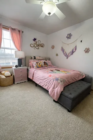 a bedroom with bed and a couch