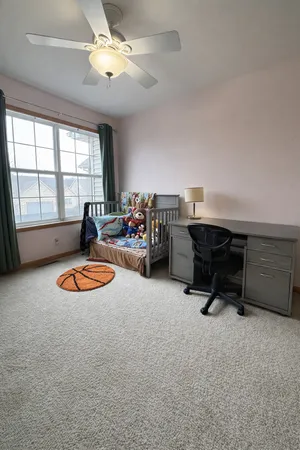 a living room with furniture pool table and a window