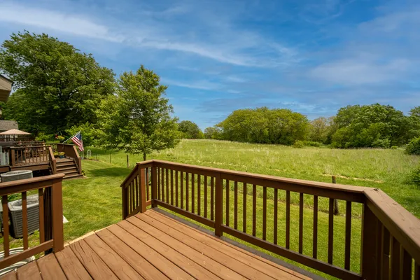 a view of a balcony with wooden floor