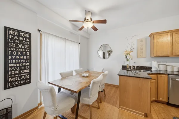 a view of a dining room with furniture and wooden floor
