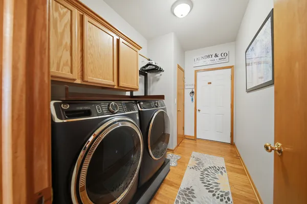 a view of a hallway with washer and dryer