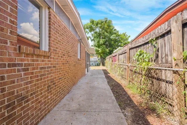 a view of a pathway with a house in the background
