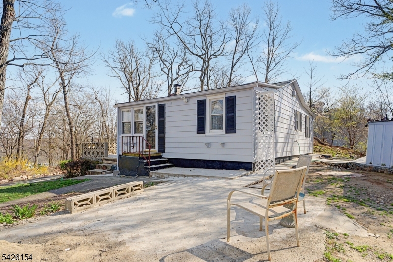 10 Berton Road Boonton, NJ 07005 - Photo 15 of 20 a view of a house with backyard and trees