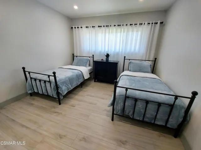 a bed room with a bed and a window