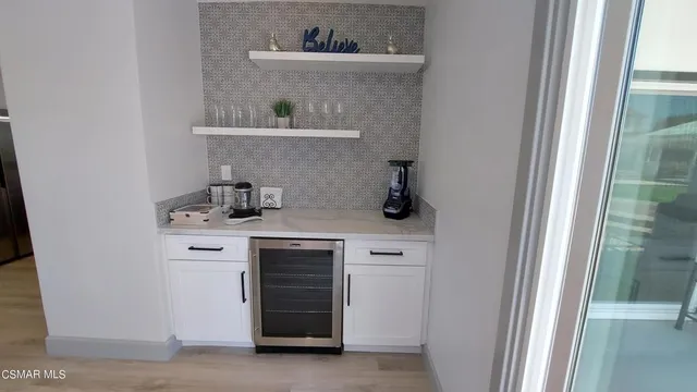 a kitchen with a stove and a refrigerator