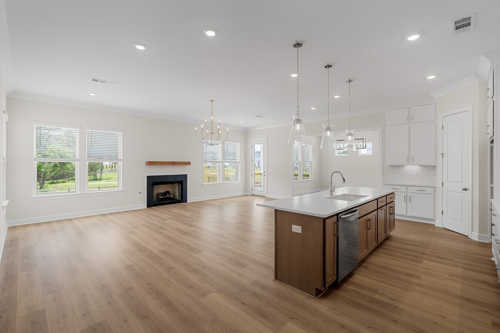 7456 Atwater Circle Fairview, TN 37062 - Photo 13 of 49 a kitchen with kitchen island a sink and a stove
