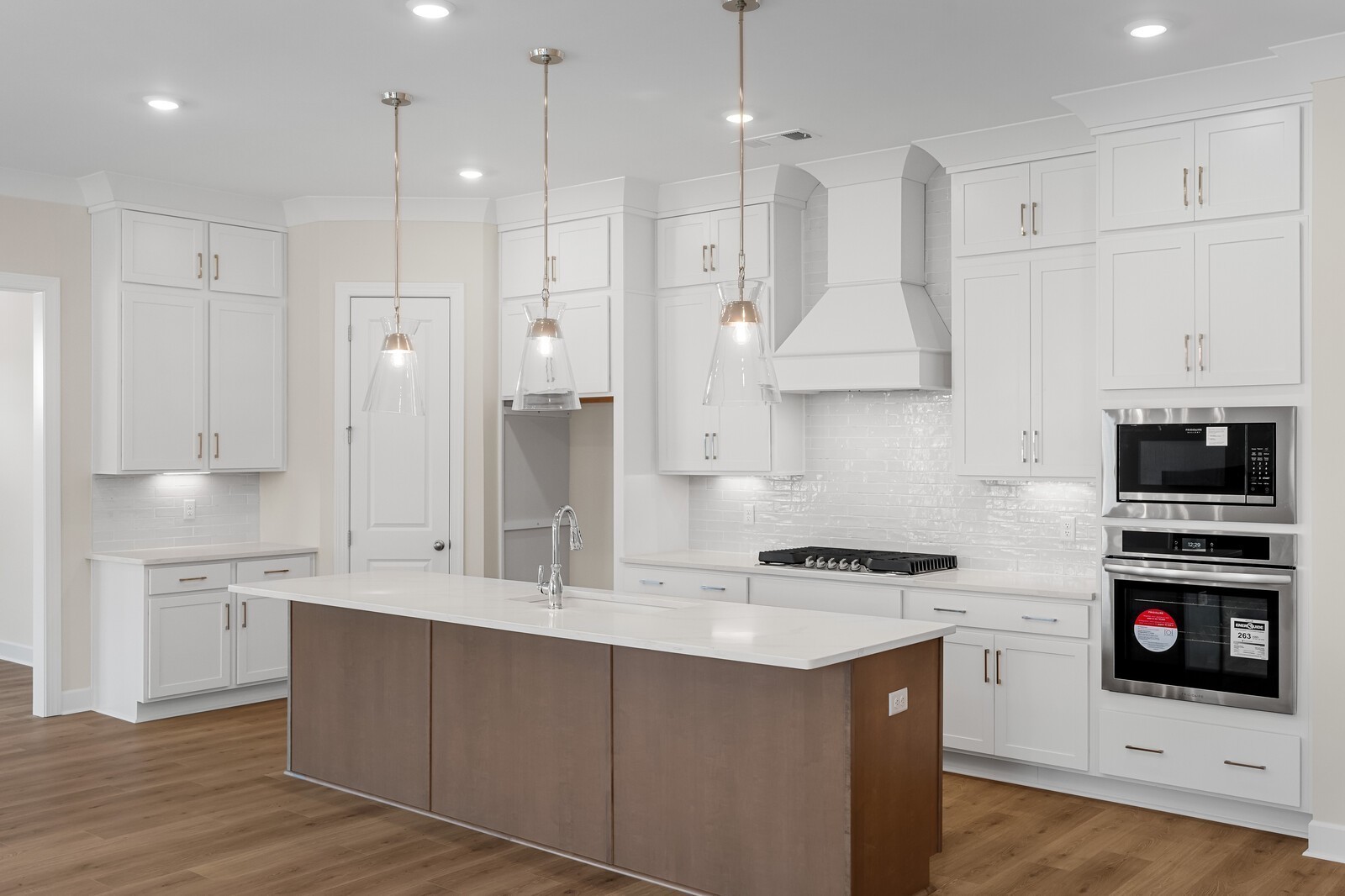 7456 Atwater Circle Fairview, TN 37062 - Photo 15 of 49 a kitchen with stainless steel appliances kitchen island granite countertop a stove a sink and a refrigerator