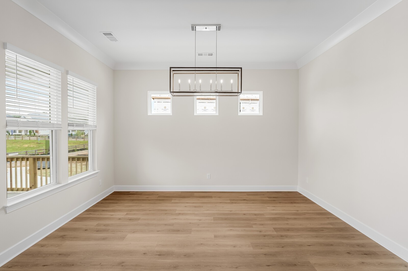 7456 Atwater Circle Fairview, TN 37062 - Photo 22 of 49 a view of an empty room with wooden floor and a window