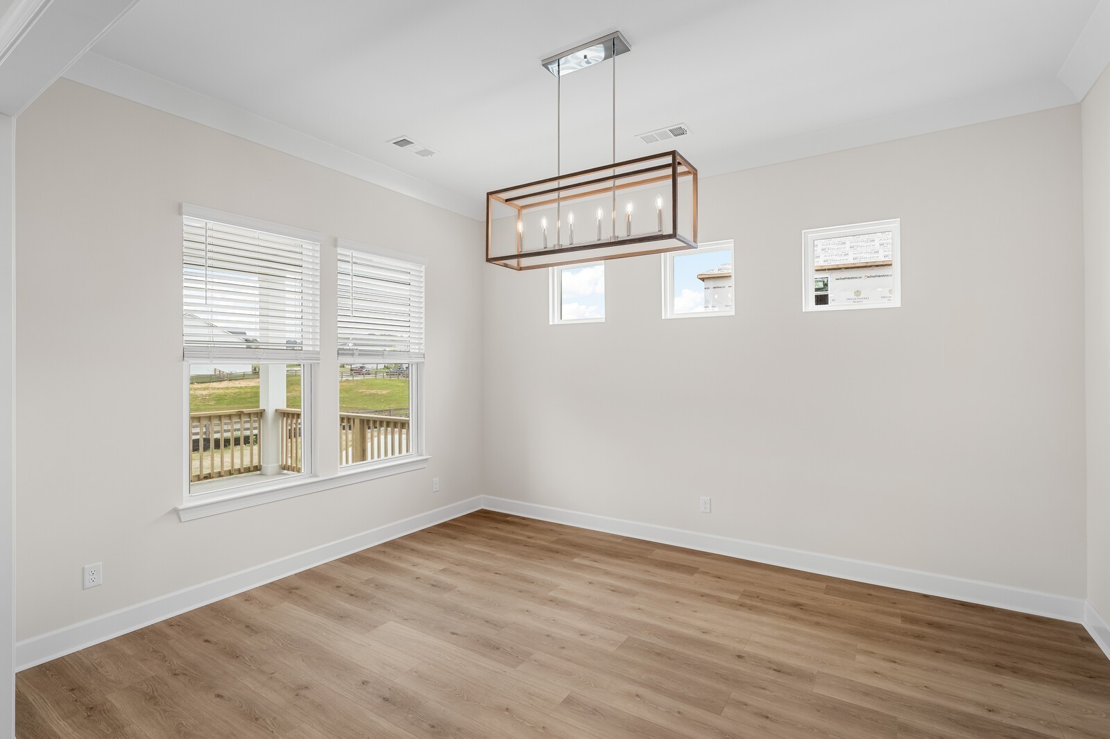7456 Atwater Circle Fairview, TN 37062 - Photo 23 of 49 an empty room with wooden floor cabinet and windows