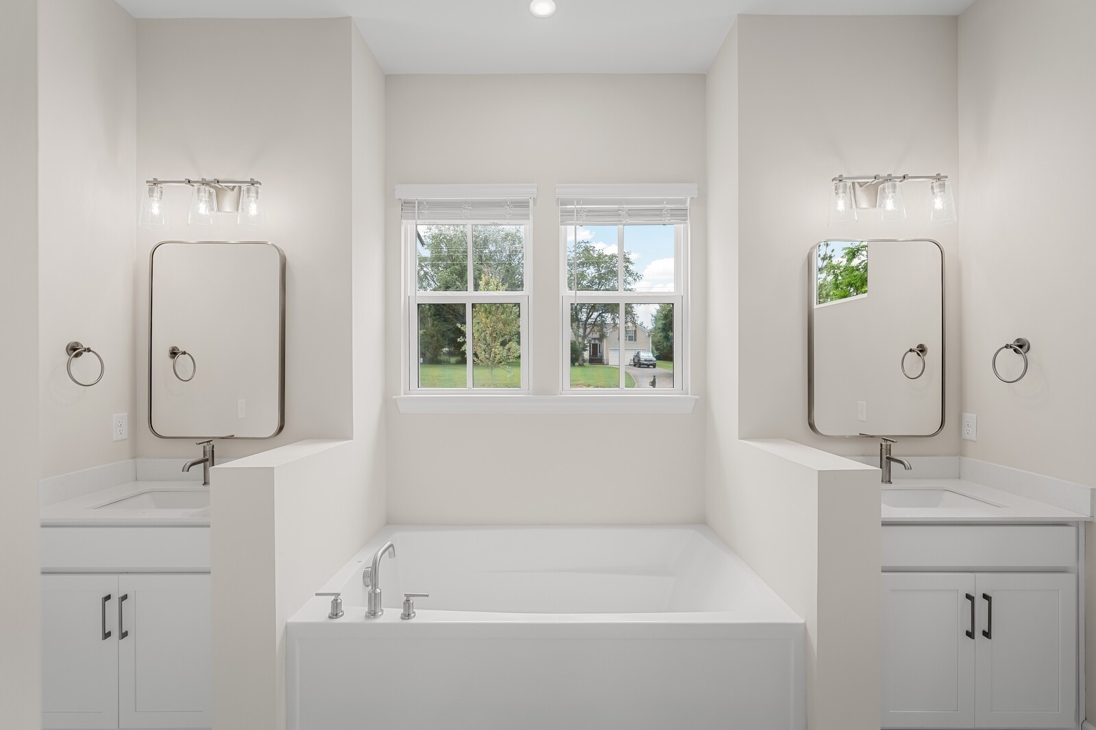 7456 Atwater Circle Fairview, TN 37062 - Photo 27 of 49 a bathroom with a tub sink and mirror