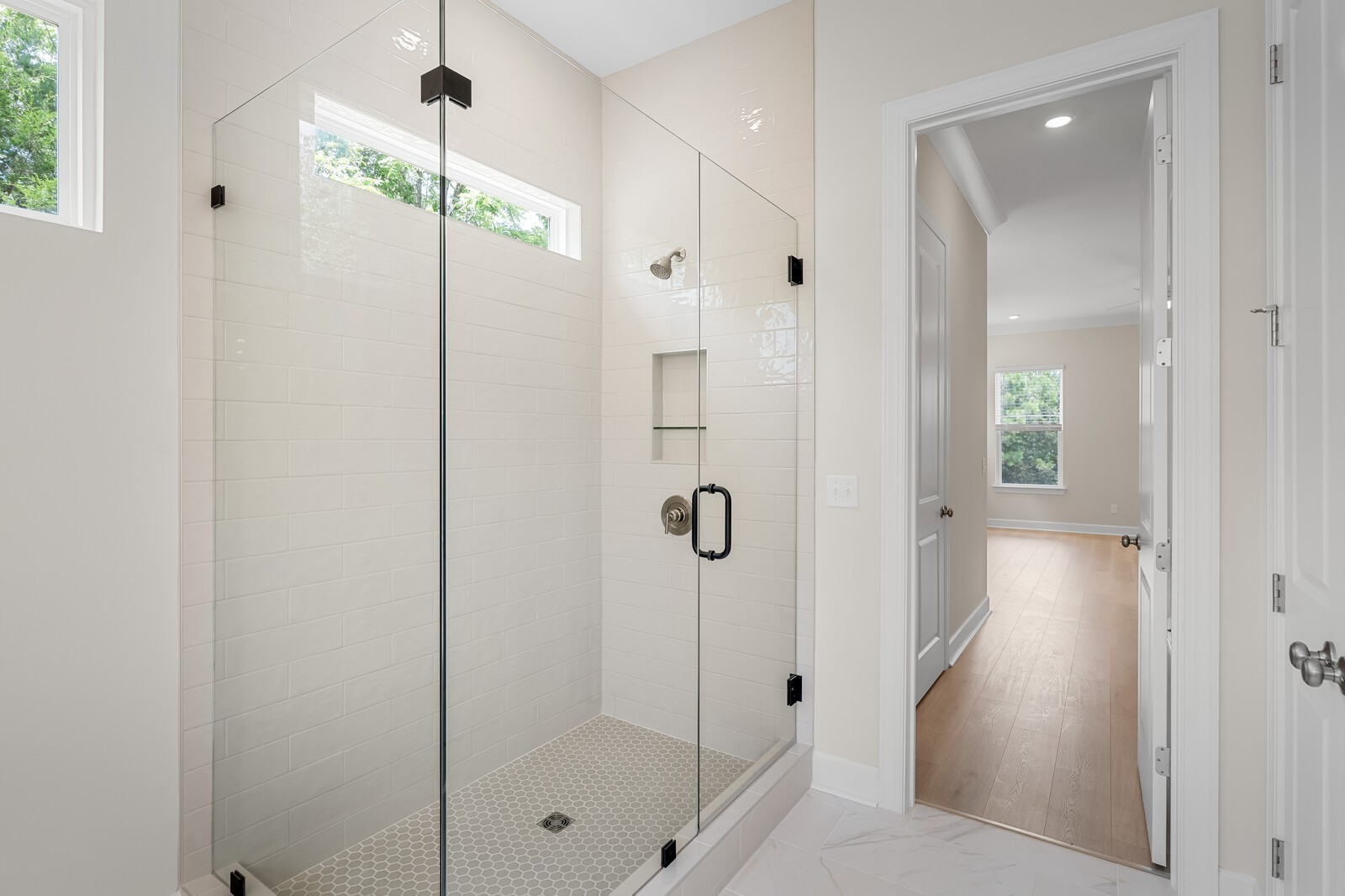 7456 Atwater Circle Fairview, TN 37062 - Photo 29 of 49 a bathroom with a glass shower door and a sink