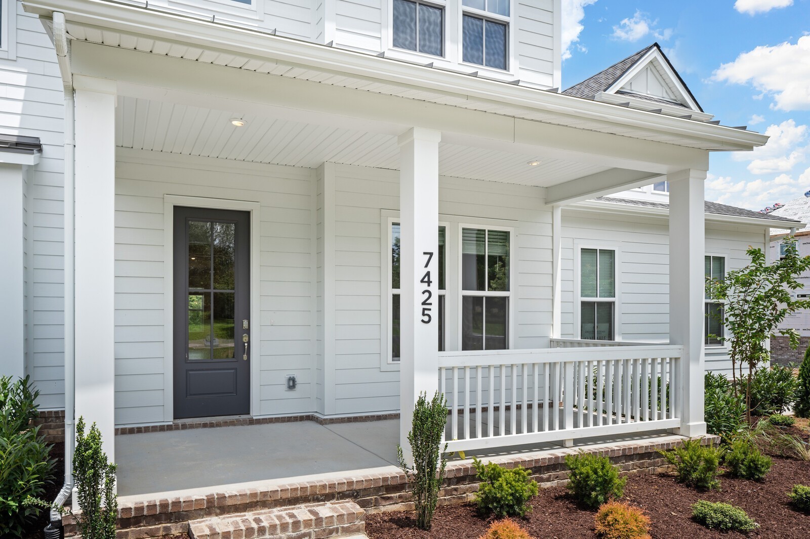 7456 Atwater Circle Fairview, TN 37062 - Photo 3 of 49 a view of a house with a small yard and wooden fence