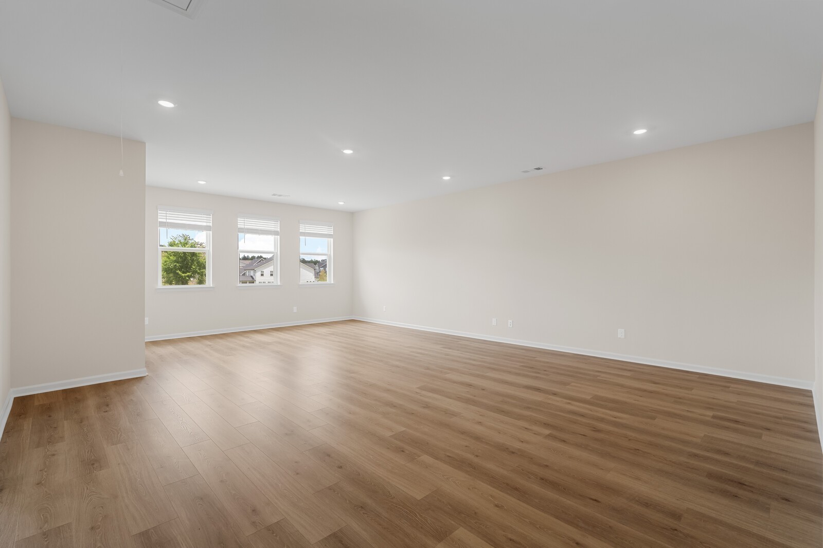 7456 Atwater Circle Fairview, TN 37062 - Photo 33 of 49 an empty room with wooden floor and windows