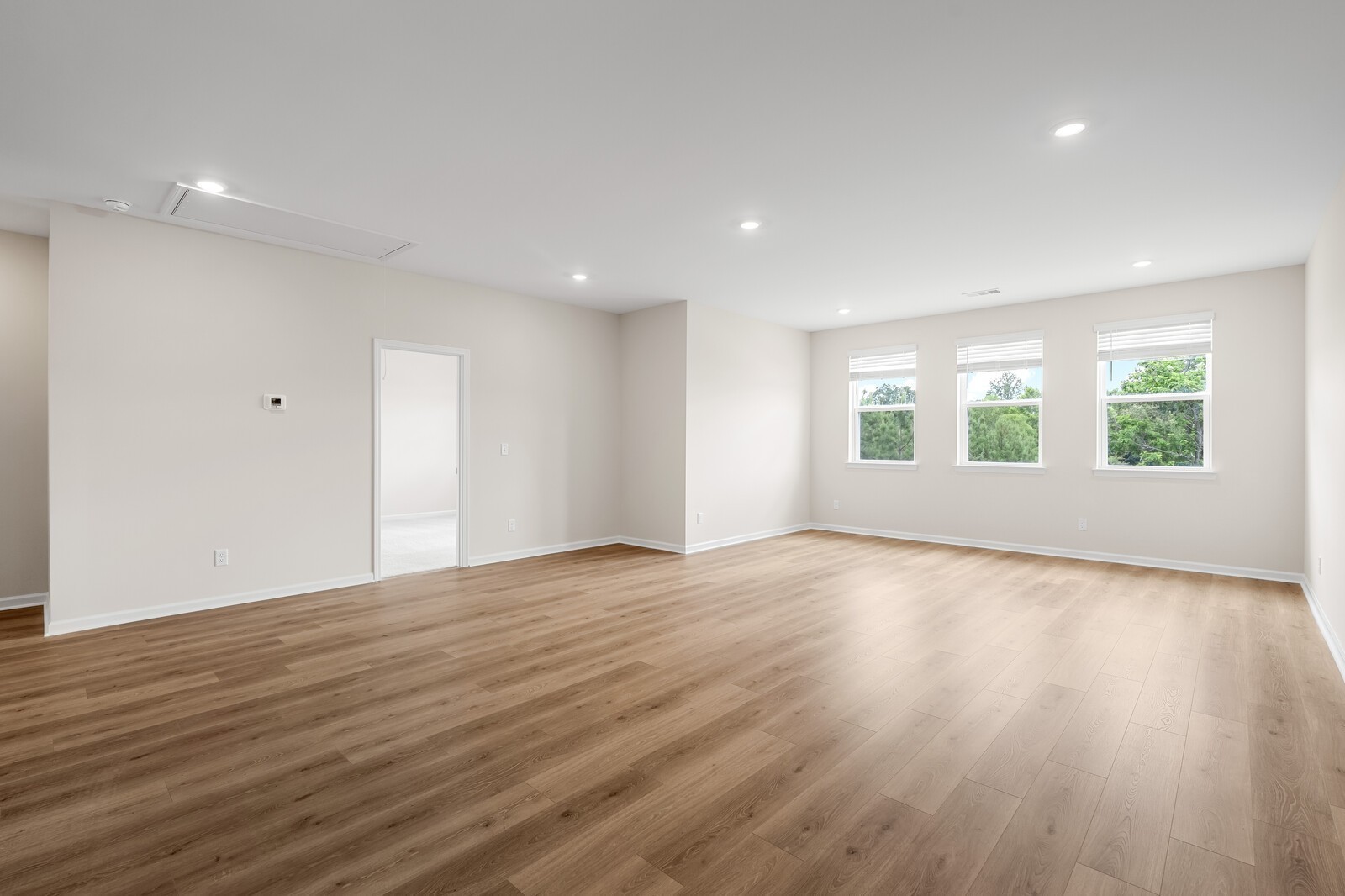 7456 Atwater Circle Fairview, TN 37062 - Photo 35 of 49 an empty room with wooden floor and windows