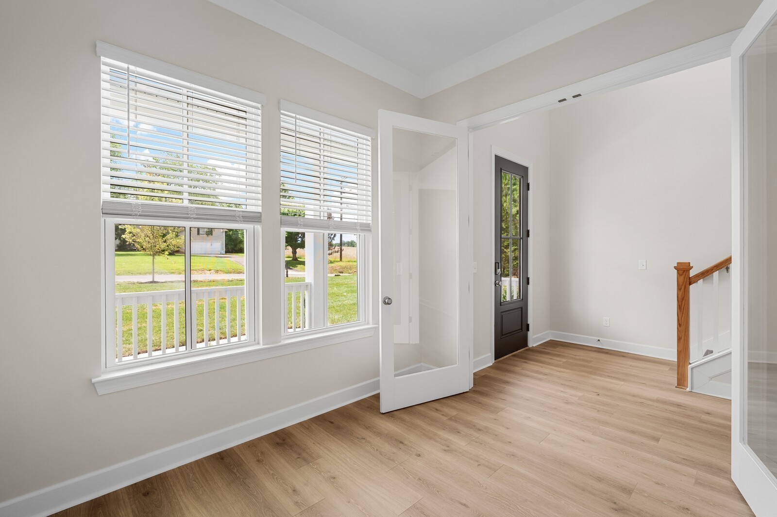 7456 Atwater Circle Fairview, TN 37062 - Photo 8 of 49 an empty room with wooden floor and windows