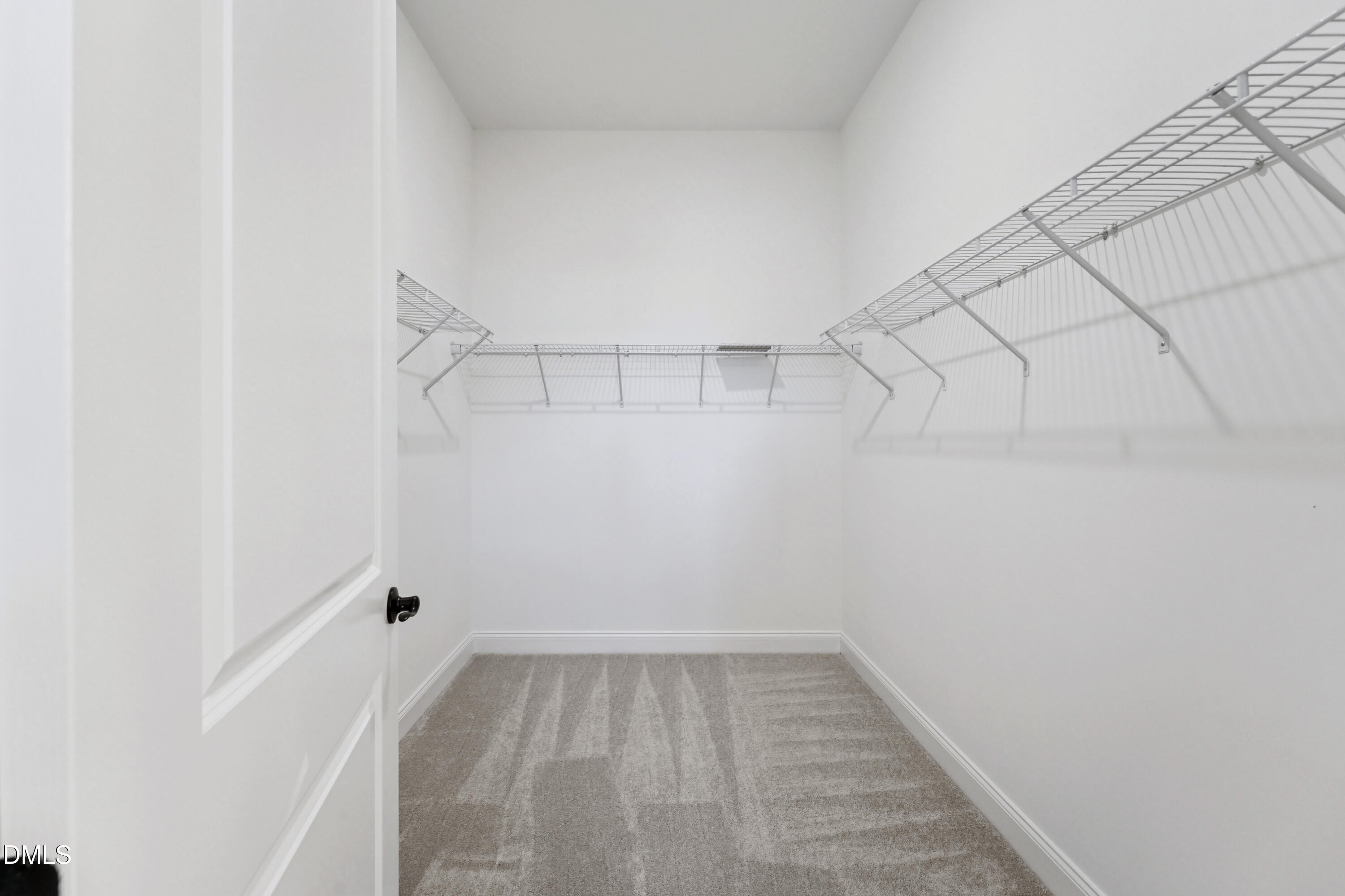 1157 Betula Road, Unit 109 Raleigh, NC 27610 - Photo 12 of 12 a view of a room with racks on the wall