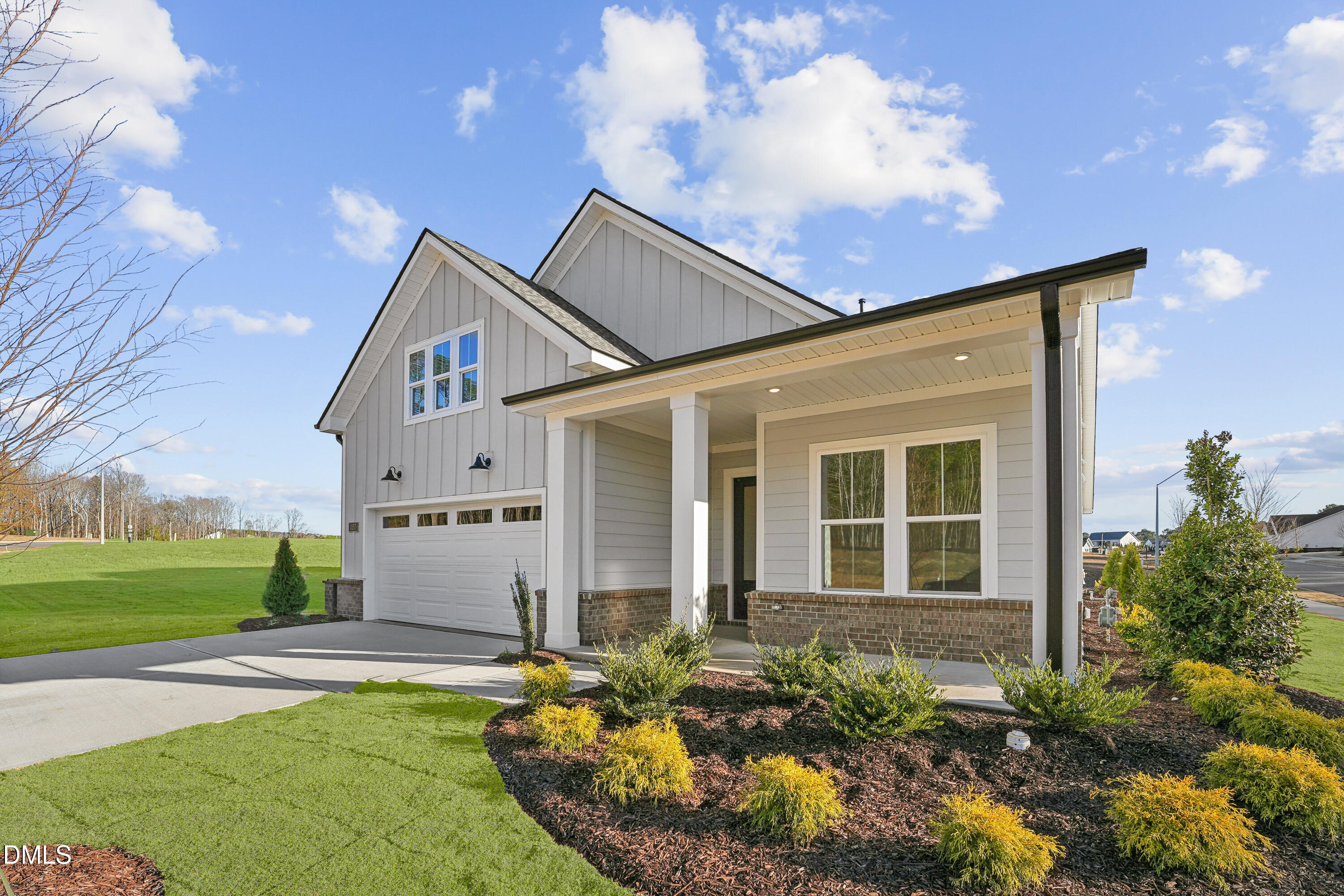 1157 Betula Road, Unit 109 Raleigh, NC 27610 - Photo 2 of 12 a front view of a house with garden