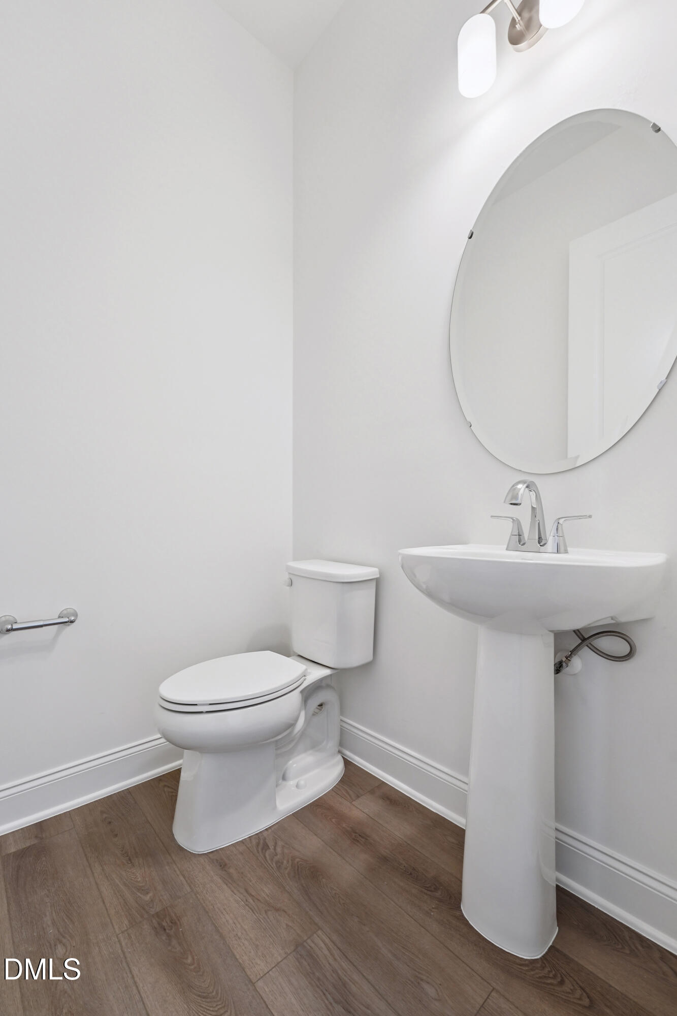 1157 Betula Road, Unit 109 Raleigh, NC 27610 - Photo 10 of 12 a bathroom with a sink and a mirror