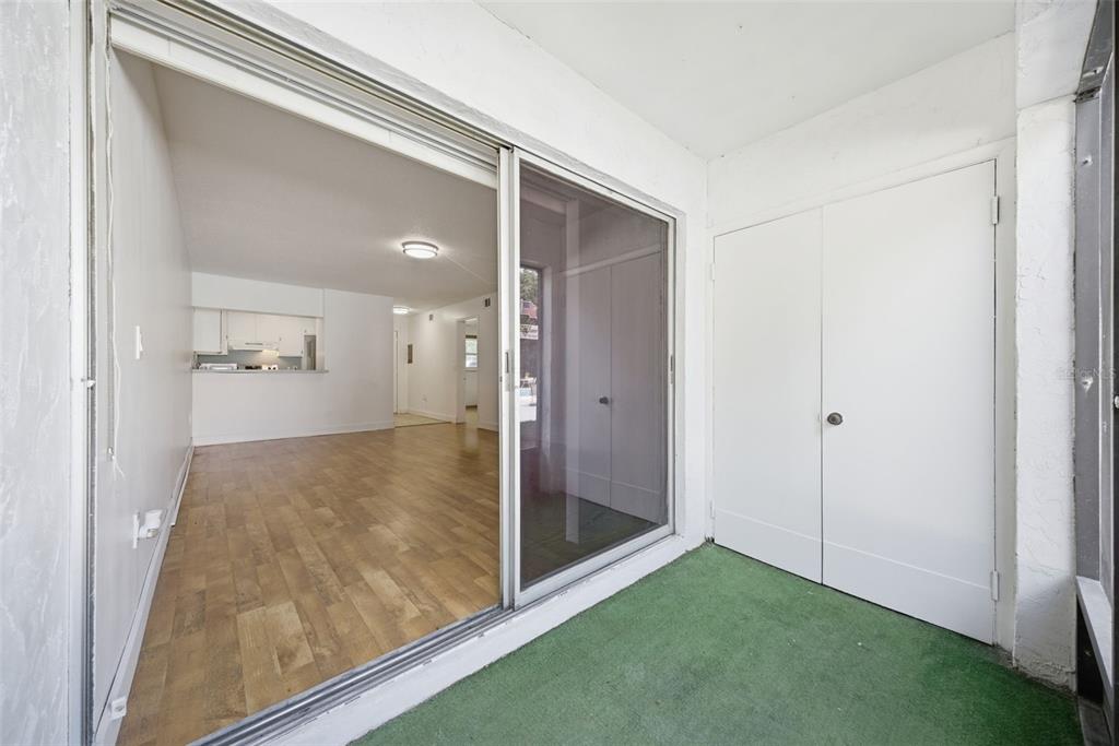 141 Fernery Road, Unit A3 Lakeland, FL 33809 - Photo 19 of 40 a view of a hallway with wooden floor and a bathroom