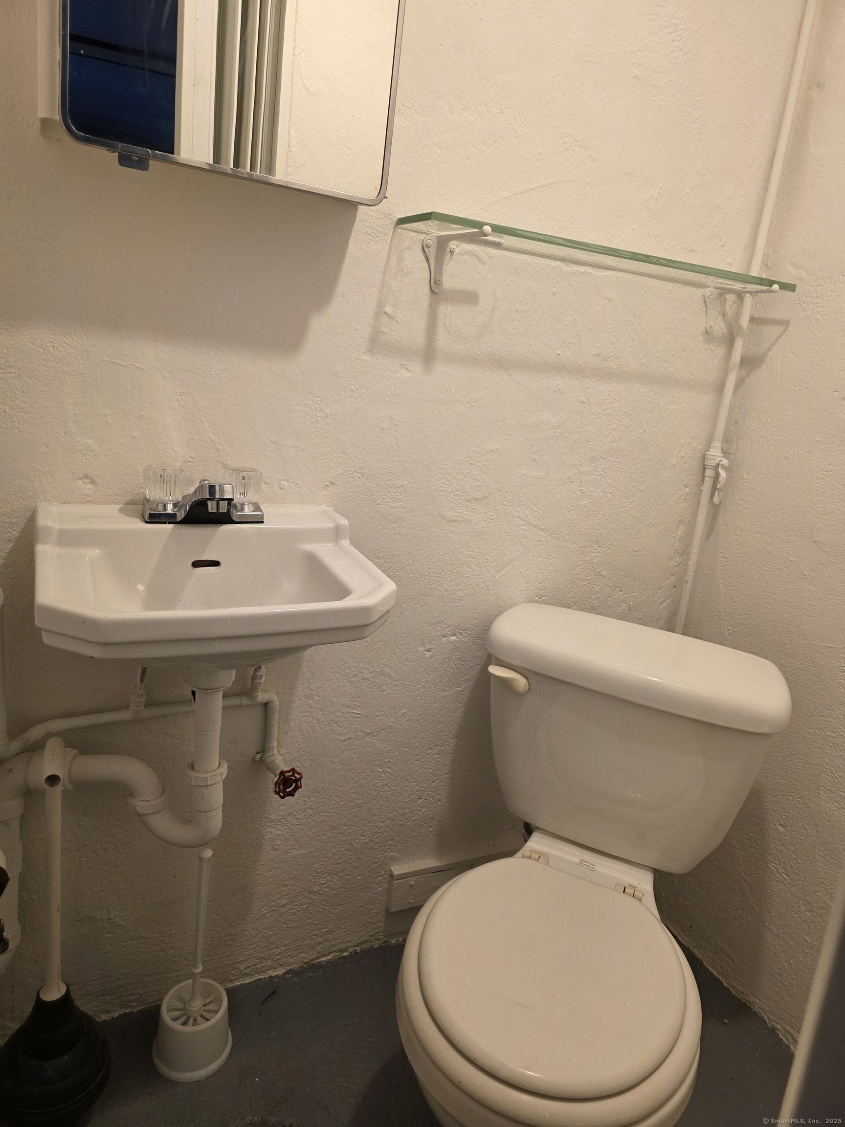 481 Bunker Hill Avenue Waterbury, CT 06708 - Photo 11 of 14 a white toilet sitting next to a white sink