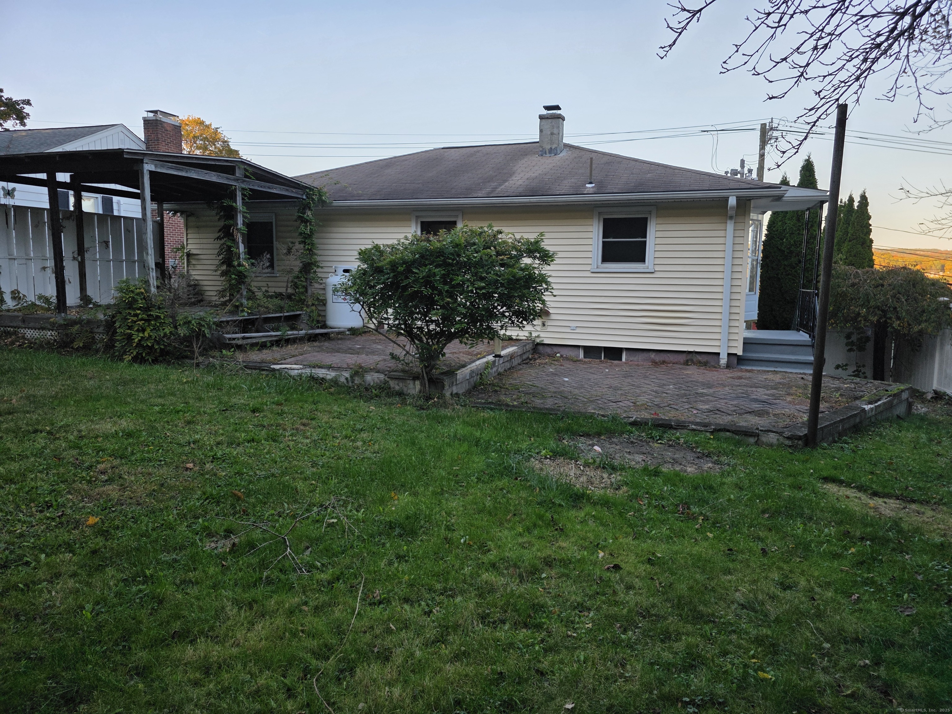 481 Bunker Hill Avenue Waterbury, CT 06708 - Photo 13 of 14 a front view of a house with a garden and plants