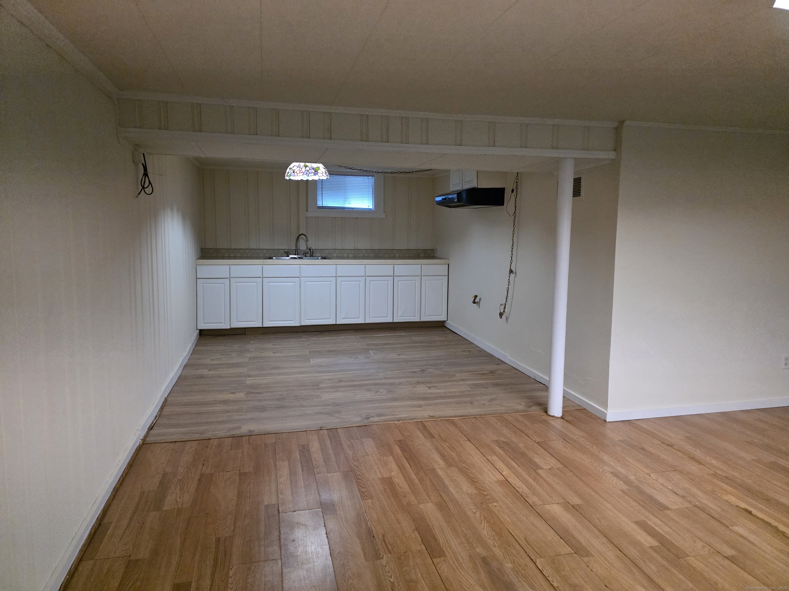 481 Bunker Hill Avenue Waterbury, CT 06708 - Photo 9 of 14 a view of room with wooden floor