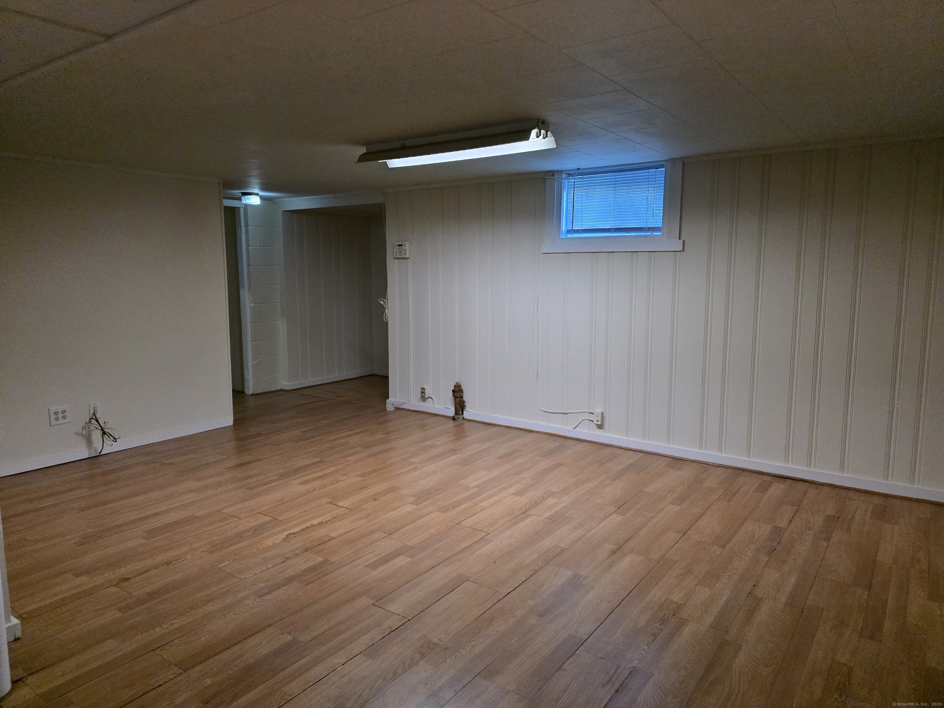 481 Bunker Hill Avenue Waterbury, CT 06708 - Photo 10 of 14 a view of an empty room with wooden floor